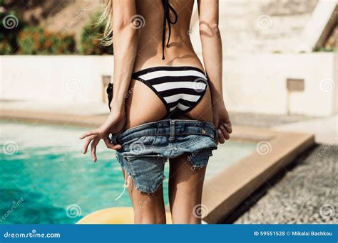 Beautiful Slim Girl In Striped Bikini Takes Off Her Shorts Stock Photo Image Of Beauty Body