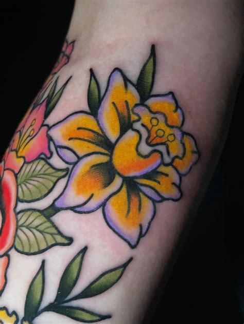 A Close Up Of A Person S Arm With Flowers On It