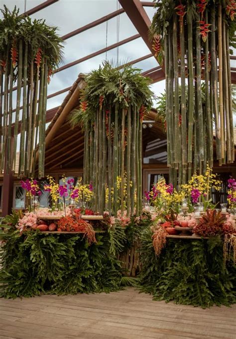 An Arrangement Of Flowers And Greenery On Display In A Building With