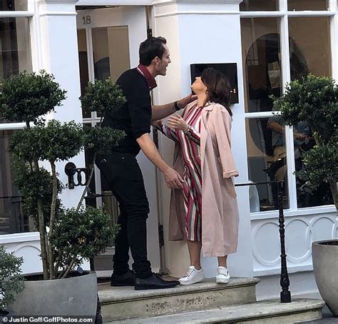 Pregnant Nadia Essex Displays Her Bump In Chic Striped Dress And Reveals Her New Brunette Locks