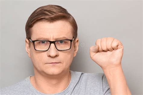 Portrait Of Serious Confident Mature Man Raising Fist Up Stock Image Image Of Gesture Person