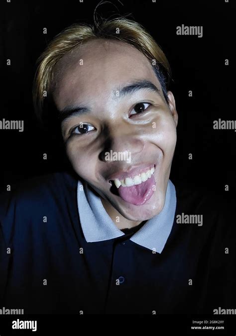 Male Making Funny Faces Isolated On Black Stock Photo Alamy