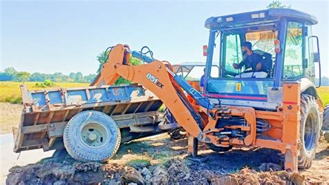 JCB 4dx Tractor Stuck In The Mud Th The Jcb Backhoe Loader Removing The