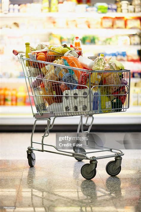 Full Shopping Cart In Grocery Store High Res Stock Photo Getty Images