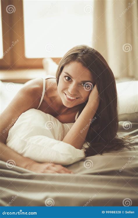 Beautiful Brunette Lying On Bed At Home Stock Photo Image Of Hair Fine