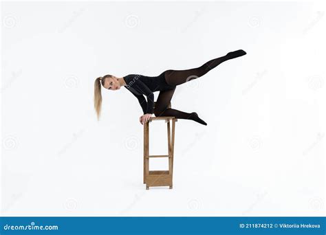 Fashion Model In Black Tights On The White Background Acrobatic Dancing Woman Posing Hot