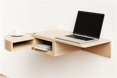 This wall-mounted desk has a revolving drawer inspired by a Matryoshka ...