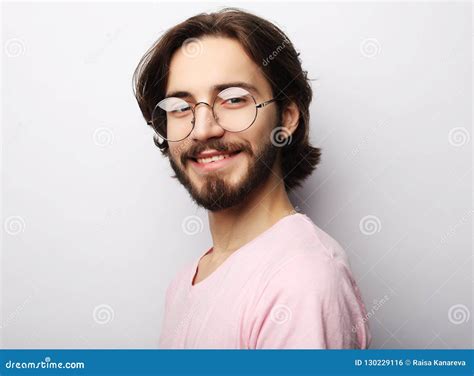 Headshot Of Satisfied Cheerful Man Wearing Glasses Glad To Find