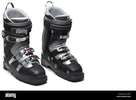 Close Up Of A Pair Of Two Black Ski Boots With Gray Lining And Three