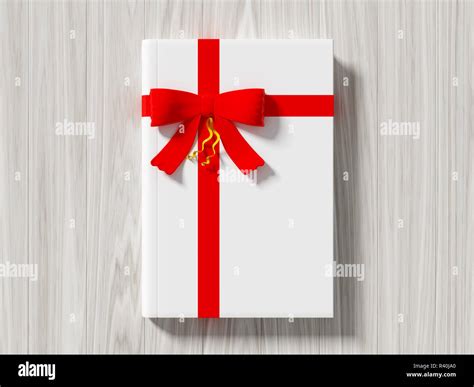 Book wrapped with color ribbon Stock Photo - Alamy