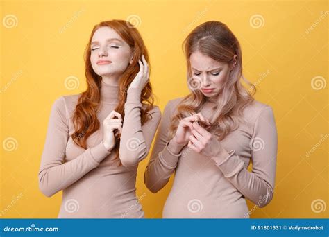 Happy Redhead Lady Touching Her Hair Near Sad Blonde Woman Stock Image Image Of Girlfriends