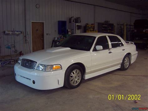 A White Police Car Parked In A Garage