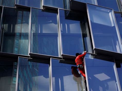 'French Spiderman' climbs Paris skyscraper as protest against pension law