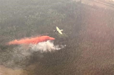‘Flared back up’: Alberta town of 8,400 evacuated for second time due to fire