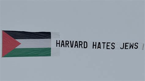 ‘Harvard Hates Jews’ banner flies above Cambridge campus as president comes under fire for Congressional testimony about antisemitism