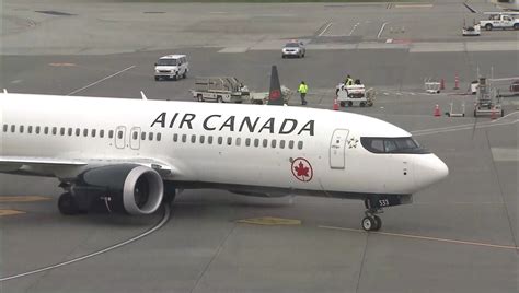 ‘They’re abandoning people:’ Dad and son bumped from Air Canada flight to UK, no explanation provided