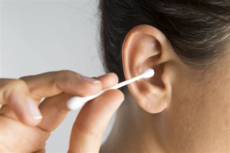 Clean ears regularly with a damp warm cloth and run a cotton swab around the edge of the canal
