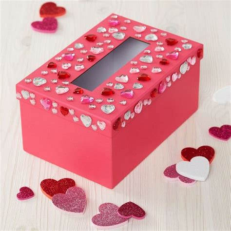  Cut a rectangular hole big enough for valentines to go into into the lid of the shoebox near the back of the head with the box cutter