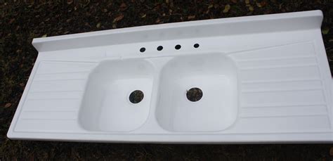  I have two large, deep enameled sinks there, which are good for soaping and rinsing