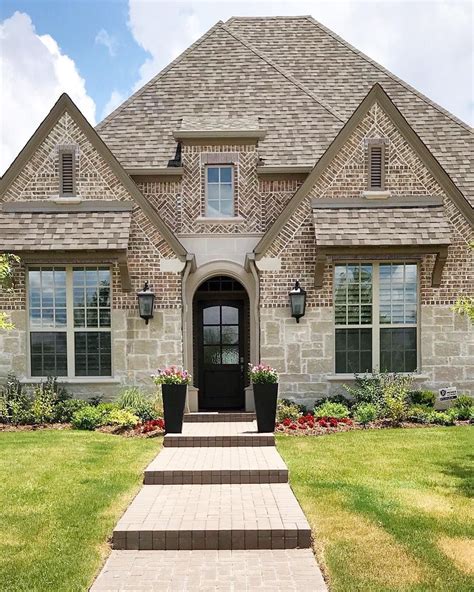  This all-brick home with stone accents is situated on a lovely tree-lined street and features 3 bedrooms and 3 bathrooms, including a primary bedroom suite with an en-suite bathroom and custom built-in closet