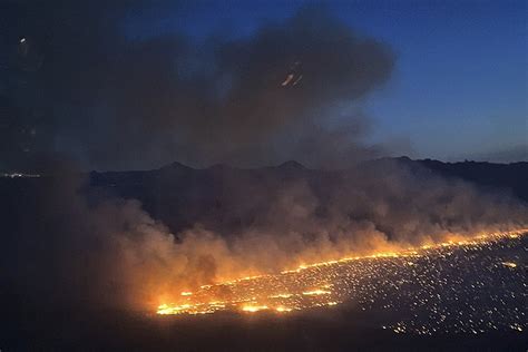 1,145 people remain evacuated as crews dig containment line around Arizona brush fire