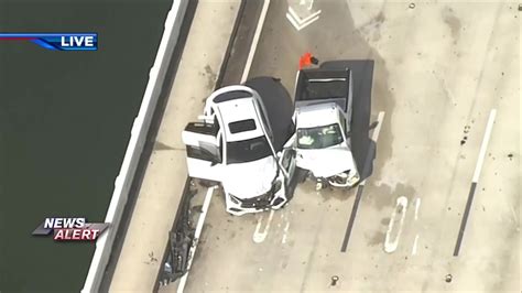 1 WB lane of 79th St. Causeway west bridge shut down after car, pickup truck collide; 1 hospitalized