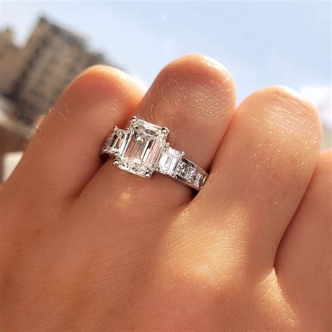 1.5 carat emerald cut diamond ring. A sophisticated shape, the emerald cut diamond’s table and step-cut facets are designed to emphasize its clarity. A Near Colorless or Colorless grade is advised if you intend to select a white metal. Most shoppers choose white gold or platinum for their emerald cut engagement ring since it aligns with the Art Deco style. The faint yellow in K ... 
