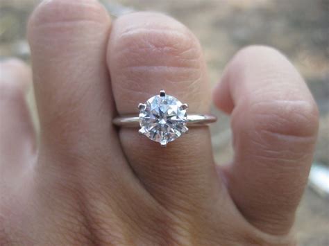 1.5 carat engagement ring. While a 2 carat natural diamond costs roughly twice as much as a 1.5 carat diamond costs, a 2 carat diamond looks just 10 percent larger when viewed from above. In terms of face-up size, a 1.5 ct diamond (round cut) measures roughly 7.3mm. However, the exact measurements for any specific 1.50ct diamond can differ based on the diamond’s cut ... 