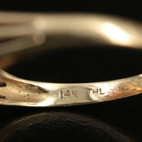 14k thl ring. .  ...
