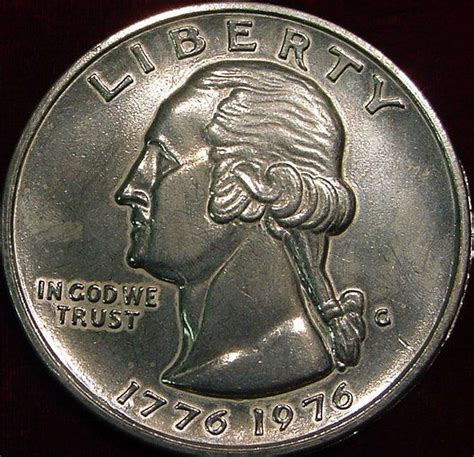 This is a rare and highly sought-after 1776-1976 D US Bicentennial Quarter with a filled mint mark. This quarter features a stunning image of George Washington on the front and the eagle on the back. It is in excellent condition and is ungraded. The coin has never been circulated and is in uncirculated condition. This quarter is a must-have for any coin collector or history enthusiast.. 