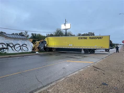 18-wheeler crashes into building, closes I-35 service road for hours Friday morning