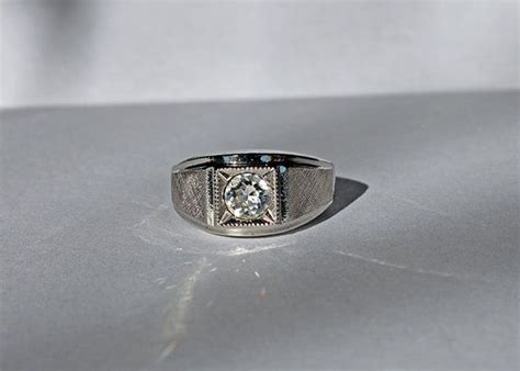 Worth of diamond ring 18kt ge. How much is a 50 year old 18k white gold diamond cluster ring worth? Is the gold ring with 18k hgt v in circle worth anything? Seta gold ring with letter r and small diamond. What is the value of an 18kt. gold ring with ge and a circled a worth?. 