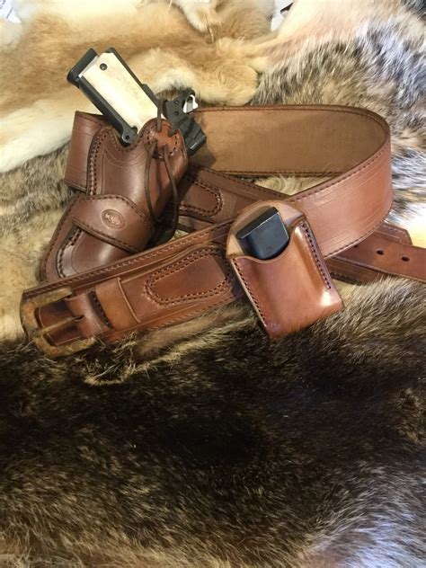 Fits models: Colt, Remington, Ruger, Kimber, Springfield RIA, Citadel, Taurus Sig, ATI, Cimarron 45ACP Model 1911 - Leather Holster and Magazine Pouch. Belt loop is about a 1 1/2". HOLSTER IS NEW. Any questions you may have email me and i'll do my best to answer them. *FREE SHIPPING IN THE USA 1st Class. Priority Mail Upgrade Available..