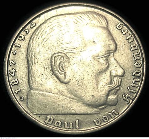 In 1935, aluminium 50 Reichspfennig coins were introduced, initially for just the one year. The nickel coins continued to be produced up to 1939. From 1936 on, all coins except the 1 Reichsmark and the first version (1935-36) of the 5 Reichsmark coin (bearing the image of the late Reichspräsident Paul von Hindenburg) bore the Nazi party insignia. . 