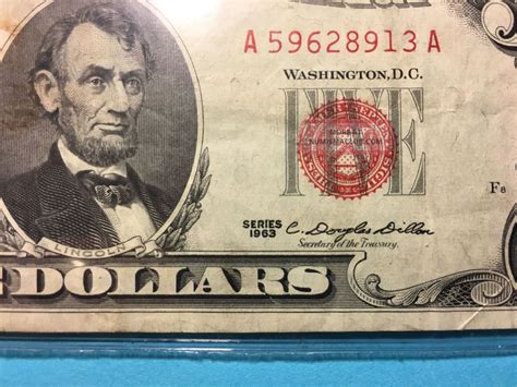 1963 red seal 5 dollar bill. Again depending on the quality, but normally with XF+ condition could be between $20-$25. People will probably advertise for $30 but settle for less if they need the money. Here is a picture of a Gem Uncirculated bill purchased back in 2004 for $25. I have a 63 red seal real close to being the shape you have. 