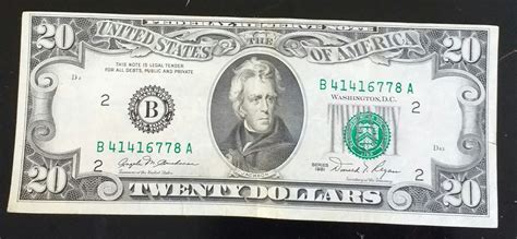 1981 dollar20 bill. The front is off set in its cut. in between the zeros of the 20s the ink is blooming. The back's cut is centered. there is ink bleeding through from the front where it wasnt centered. it would seem the cut was made based on the back, and the front and back ink do not line up. Its a 1981 NY. No strip or water mark because of the year it was made. 0. 