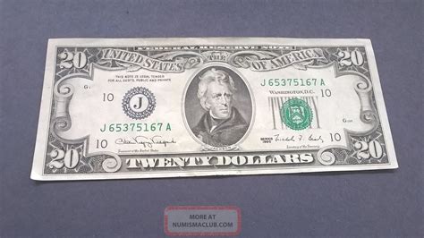 2. Verify the Color-Changing Ink. Color-changing ink can be found on the obverse side of the bill on the numeral "20" located on the lower right corner. When you hold the bill up at an angle, the color should change from copper to green. Color-changing ink was first added to the $20 bill in 1996. 3.. 