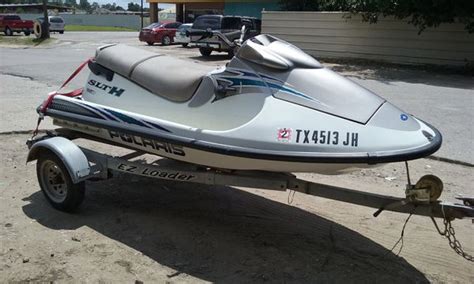 1999 Polaris SLTH. This Polaris personal watercraft has a plastic hull, is 10 feet long and 49 inches wide at the widest point. The boat weighs approximately 595 pounds with an empty fuel tank and without any gear or passengers. Despite the plastic hull on this personal watercraft, we recommend that the boat be kept dry and covered in order to .... 