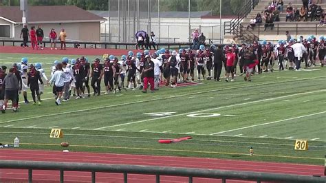2 arrested, including armed teen, after large brawl at prep football game in Aurora