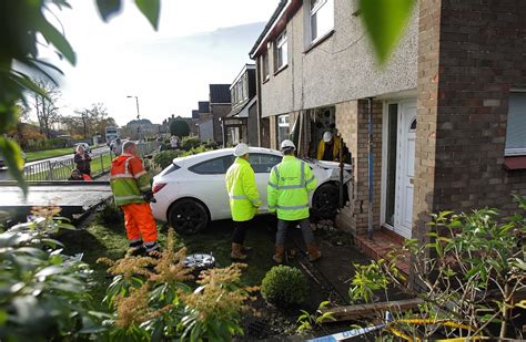 2 injured after car crashes in to house in Swansea