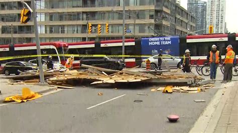 2 injured after scaffolding collapses at Spadina and Bremner; road closures