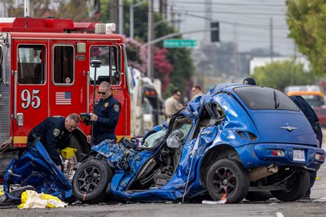 2 killed when car slams into firetruck in South Los Angeles; 4 firefighters hospitalized