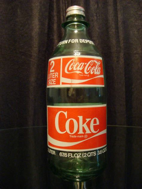 2 liter glass coke bottle. The answer is 2 liters of water weighs 4.40 pounds. How big is a 2 liter label? 2 Liter Soda Bottle Labels are sold in quantities of one (1) per order. They are self-adhesive and pre-cut. Approximate size of each label is 5 1/4” x 9 3/4”. These labels are designed to fit a standard 2 liter soda bottle. 