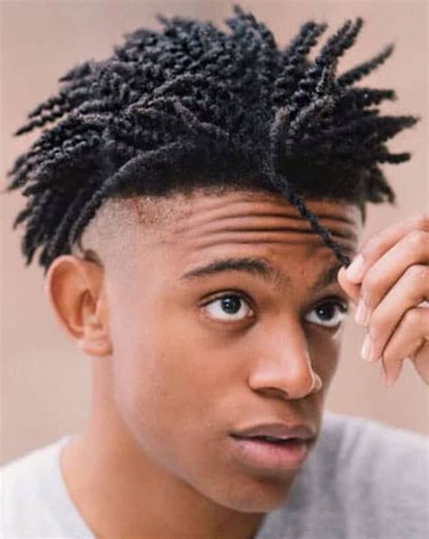 The island twist mohawk is a daring and edgy hairstyle that combines the boldness of a mohawk with the elegance of twists. This hairstyle features a center strip of twists that stand tall, creating a distinctive and captivating look. The sides are often shaved or tightly cropped to accentuate the contrast.