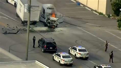 2 trucks catch fire following collision in NW Miami-Dade