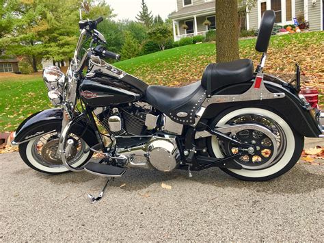 2006 heritage softail classic blue book. FLSTN/I Softail Deluxe combines easy-riding comfort with a heavy dose of nostalgia to create an eye-catching custom that's a joy to ride. It hugs the road on lowered suspension. The pull-back ... 