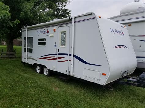 2007 Jayco Jay Feather EXP 23B, JAY FEATHER EXP One-Piece Seamless TPO Roof Enclosed Underbelly E-Z Lube Axles Retractable Entrance Step White Spoked Wheels Monitor Panel for All Systems Pleated Night Shades Mini Blinds 3-Burner Range Refrigerator Range Hood w/Light Fan Marine Toilet w/Foot Flush ... This 24 Ft camper has an empty weight of ....