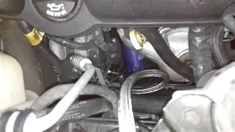 There is an AC sticker in the engine bay of your 2013 Tr