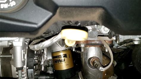 Shut off engine and recheck oil level after 5 