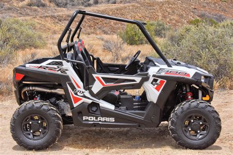 Rear Suspension. Dual A-Arm with Stabilizer Bar and 13.2 in (33.5 cm) Wheel Travel. Find specifications for the 2020 Polaris RZR Trail S 900 White such as engine, drivetrain, dimensions, brakes, tires, wheels, payload capacity and cargo system. . 